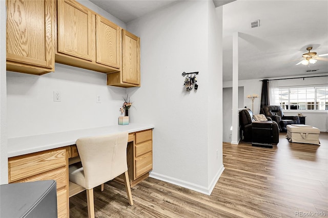 4251 S Blackhawk Cir Unit 3E, Aurora, CO 80014 - office area with built in study area, light wood-style flooring, and ceiling fan