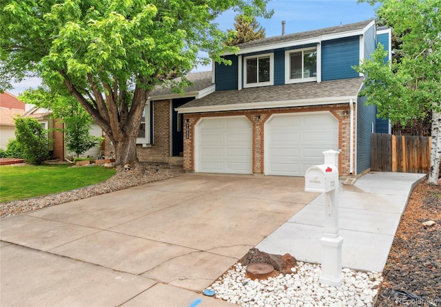 7035 S Flower Ct, Littleton, CO 80128 - split level home featuring a shingled roof, a garage, brick siding, and concrete driveway