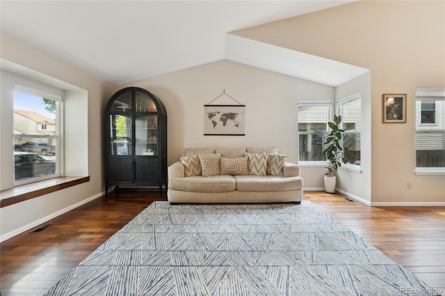 7035 S Flower Ct, Littleton, CO 80128 - living area with wood-type flooring, plenty of natural light, lofted ceiling, and baseboards