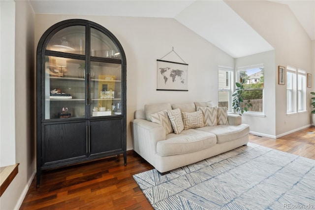 7035 S Flower Ct, Littleton, CO 80128 - living area featuring wood finished floors, lofted ceiling, and baseboards