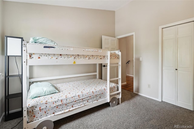 7035 S Flower Ct, Littleton, CO 80128 - carpeted bedroom with baseboards and a closet