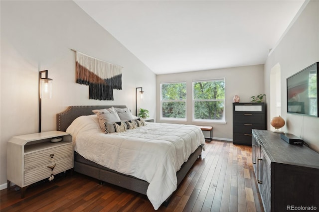7035 S Flower Ct, Littleton, CO 80128 - bedroom featuring dark wood-type flooring, vaulted ceiling, and baseboards