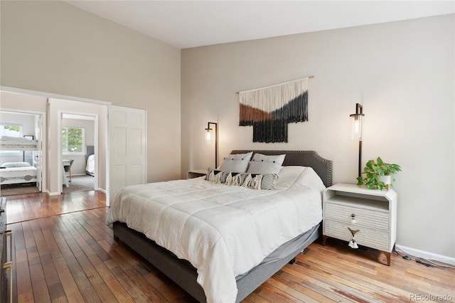 7035 S Flower Ct, Littleton, CO 80128 - bedroom featuring wood-type flooring and baseboards