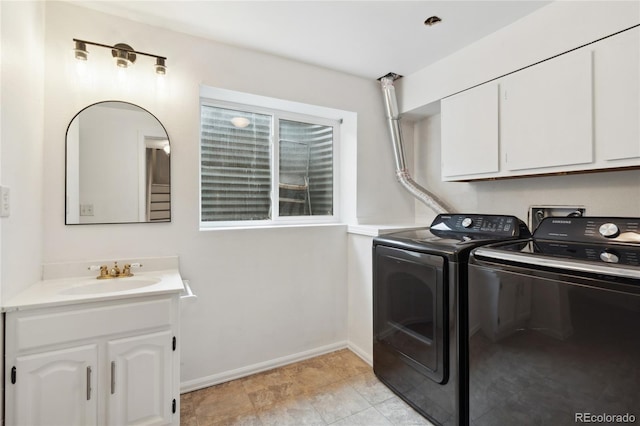 7035 S Flower Ct, Littleton, CO 80128 - laundry area with washer and dryer, baseboards, and cabinet space