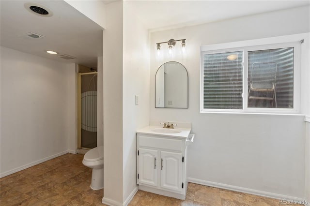 7035 S Flower Ct, Littleton, CO 80128 - full bath with vanity, baseboards, toilet, and a stall shower