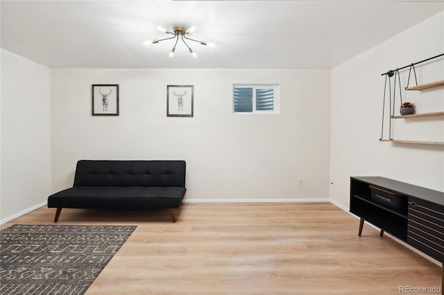 7035 S Flower Ct, Littleton, CO 80128 - sitting room with a chandelier, wood finished floors, and baseboards