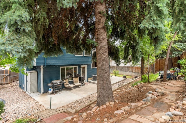 7035 S Flower Ct, Littleton, CO 80128 - back of property with a patio and a fenced backyard