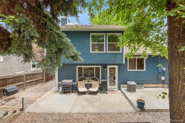 7035 S Flower Ct, Littleton, CO 80128 - back of house with a patio and a shingled roof