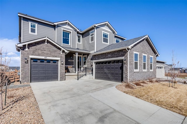 view of front of home with stone siding and concrete driveway