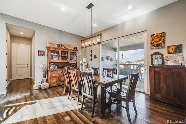 dining space featuring dark wood-type flooring, recessed lighting, and baseboards