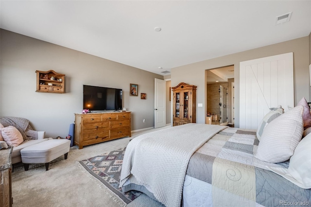 bedroom with visible vents, light carpet, and baseboards