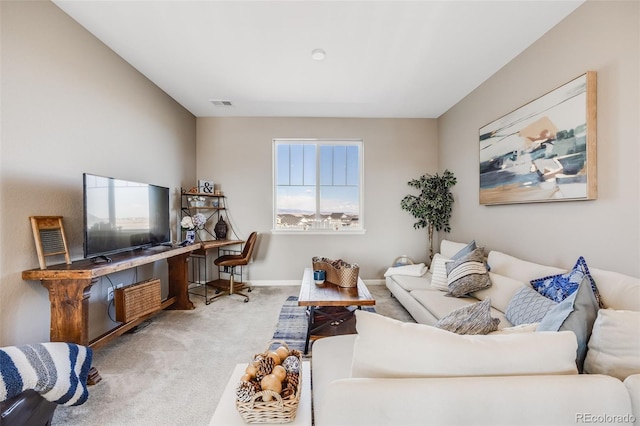 carpeted living room with visible vents and baseboards