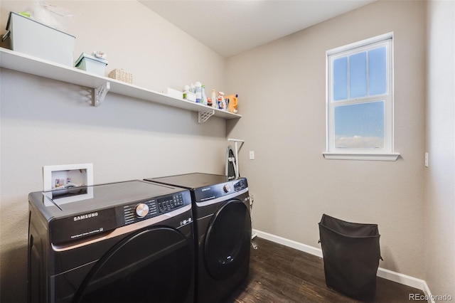 laundry room featuring dark wood-type flooring, laundry area, baseboards, and washing machine and clothes dryer