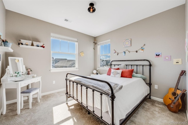 bedroom featuring carpet floors, baseboards, and visible vents