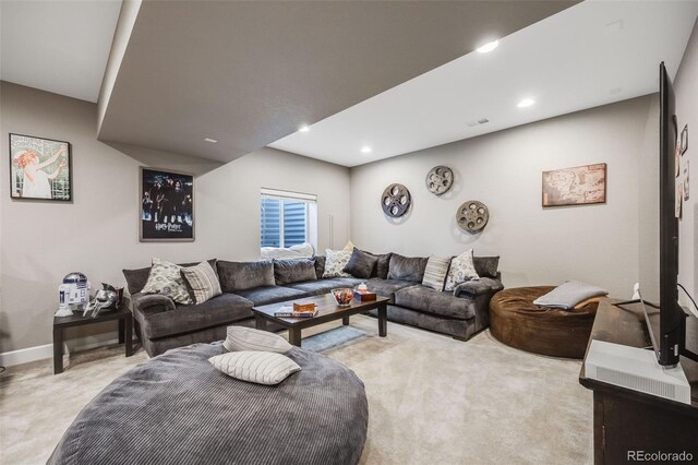 living area featuring light carpet, baseboards, and recessed lighting