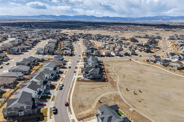 drone / aerial view with a residential view and a mountain view