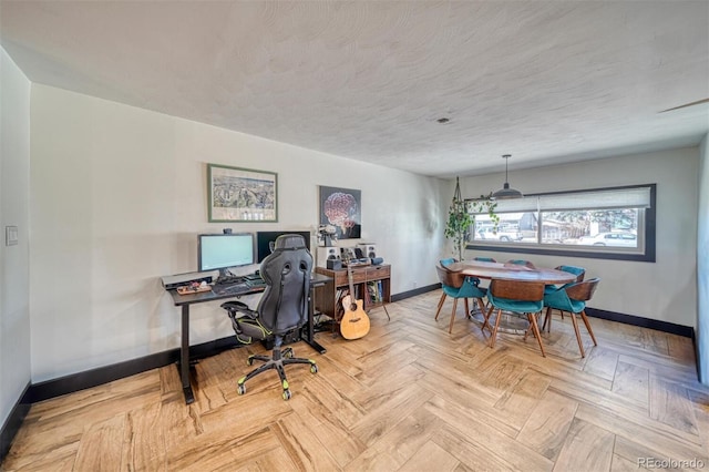 office with a textured ceiling and light parquet floors