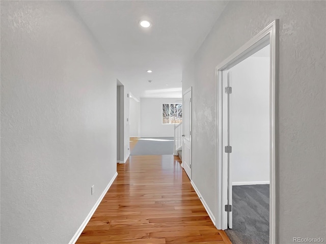 hallway with light wood-type flooring