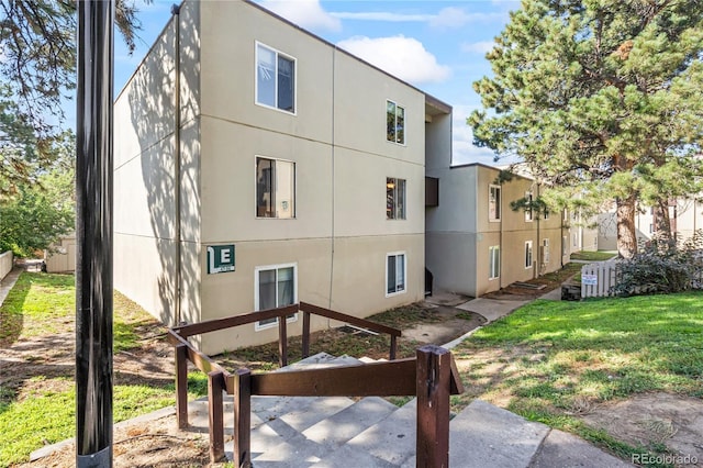 9700 E Iliff Ave Unit E51, Denver, CO 80231 - rear view of house with stucco siding