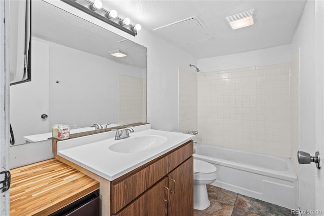 9700 E Iliff Ave Unit E51, Denver, CO 80231 - bathroom with vanity, washtub / shower combination, and stone finish floors