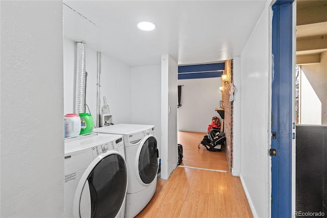 9700 E Iliff Ave Unit E51, Denver, CO 80231 - washroom with washing machine and dryer, light wood-style floors, and recessed lighting