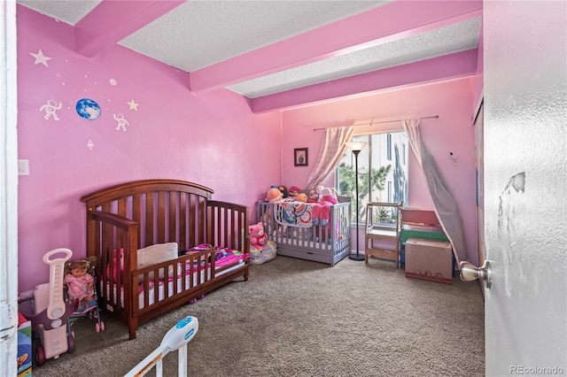 9700 E Iliff Ave Unit E51, Denver, CO 80231 - bedroom with beam ceiling, carpet flooring, a textured ceiling, and a crib