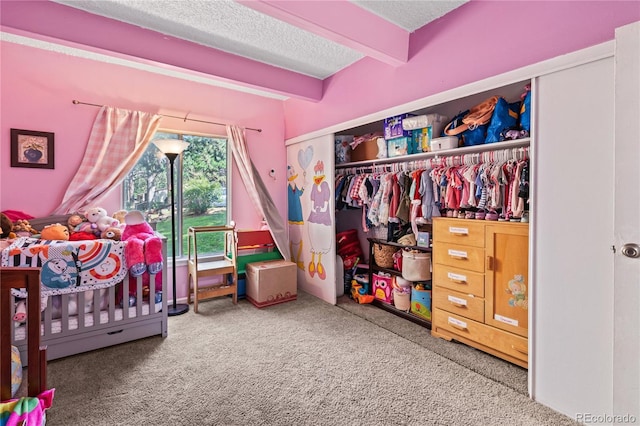 9700 E Iliff Ave Unit E51, Denver, CO 80231 - carpeted bedroom featuring a textured ceiling, beam ceiling, and a closet