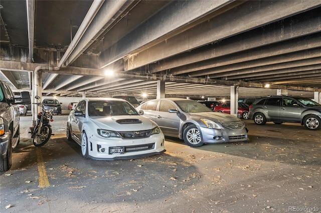 9700 E Iliff Ave Unit E51, Denver, CO 80231 - view of vehicle parking featuring a parking garage