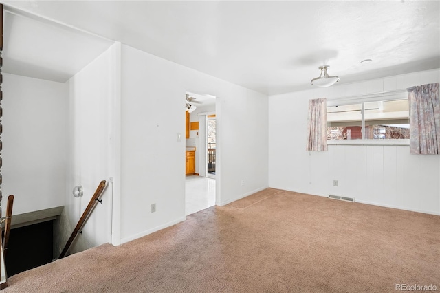 empty room featuring light colored carpet