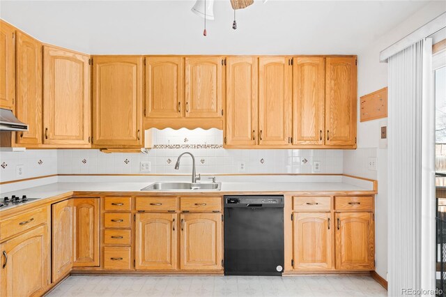 kitchen featuring ceiling fan, black dishwasher, sink, and decorative backsplash