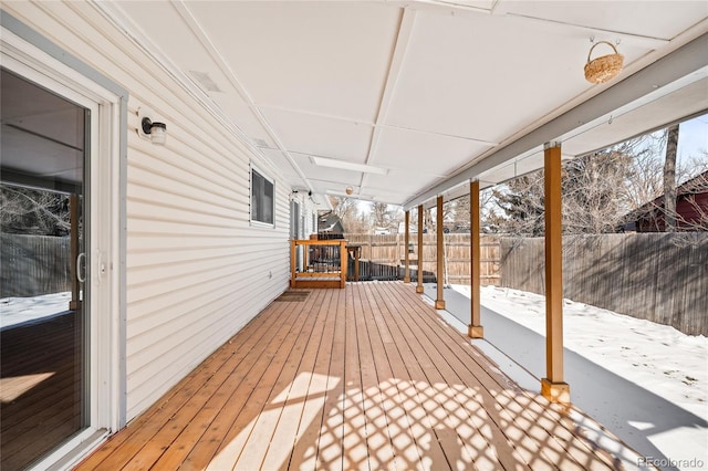 view of snow covered deck