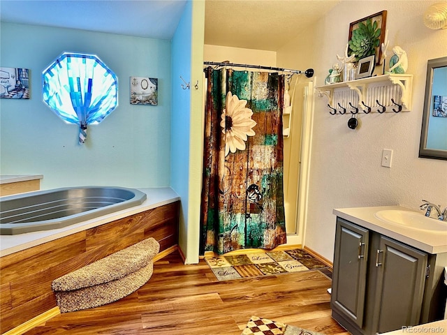 bathroom with hardwood / wood-style flooring, vanity, and a shower with shower curtain