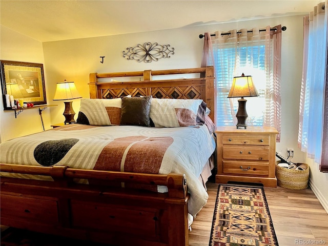 bedroom with hardwood / wood-style floors