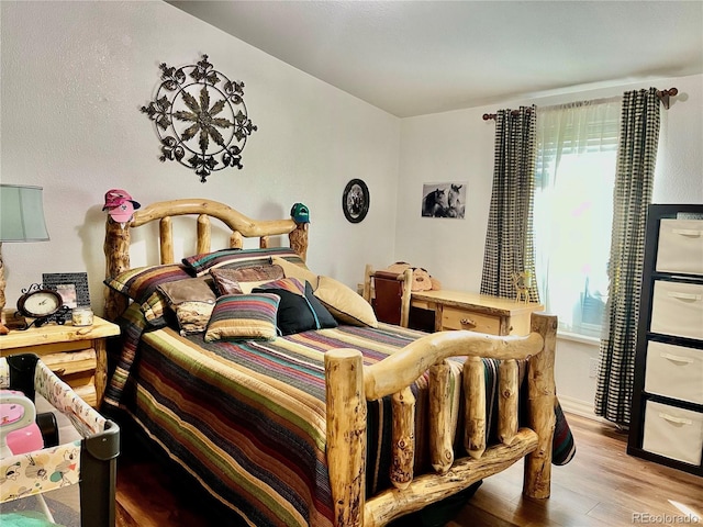 bedroom featuring hardwood / wood-style flooring