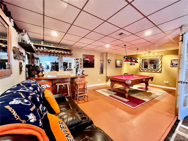 recreation room featuring billiards, bar, and a paneled ceiling