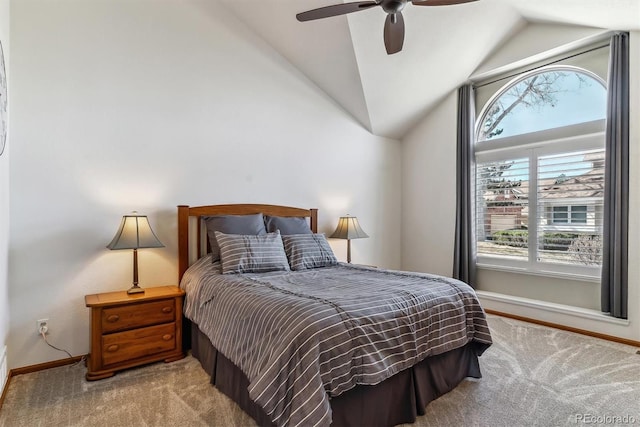 bedroom with carpet flooring, ceiling fan, baseboards, and lofted ceiling