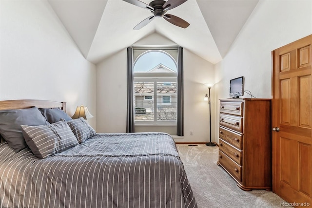 carpeted bedroom with lofted ceiling