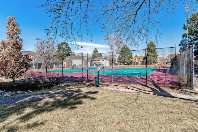 exterior space featuring a lawn and fence