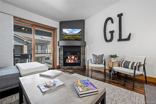504 Ravenwood Dr Unit B2, Grand Lake, CO 80447 - living area featuring wood finished floors and a stone fireplace