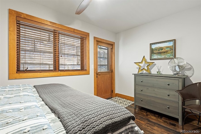 504 Ravenwood Dr Unit B2, Grand Lake, CO 80447 - bedroom with dark wood finished floors, baseboards, and ceiling fan