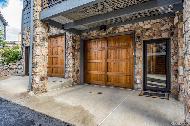 504 Ravenwood Dr Unit B2, Grand Lake, CO 80447 - property entrance featuring stone siding and a garage