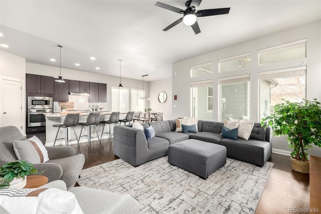 living room featuring recessed lighting, wood finished floors, and a ceiling fan