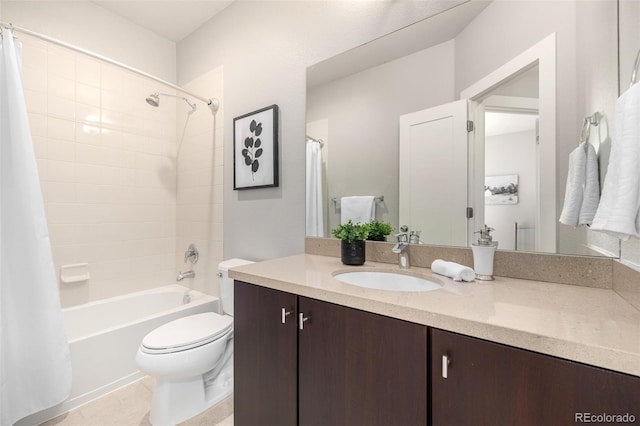 bathroom with vanity, tile patterned floors, toilet, and shower / bath combo with shower curtain