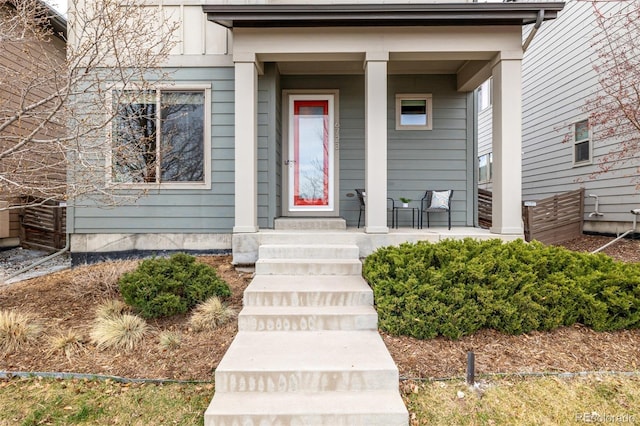 entrance to property featuring covered porch