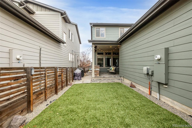 view of yard with a patio area and a fenced backyard