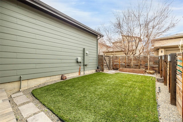 view of yard featuring a fenced backyard
