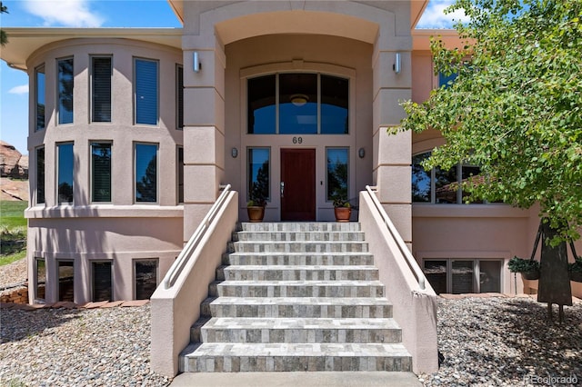 69 N Ranch Rd, Littleton, CO 80127 - property entrance featuring stucco siding