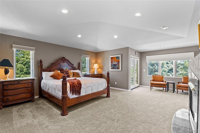69 N Ranch Rd, Littleton, CO 80127 - bedroom with light carpet, access to outside, recessed lighting, multiple windows, and baseboards