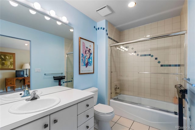 69 N Ranch Rd, Littleton, CO 80127 - bathroom featuring vanity, tile patterned floors, toilet, enclosed tub / shower combo, and recessed lighting