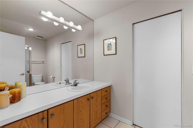 69 N Ranch Rd, Littleton, CO 80127 - bathroom featuring vanity, toilet, tile patterned flooring, a shower, and baseboards